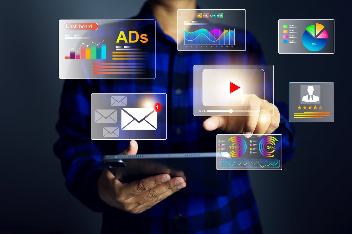 Media buyer reviewing engagement results on a tablet within a marketing platform
